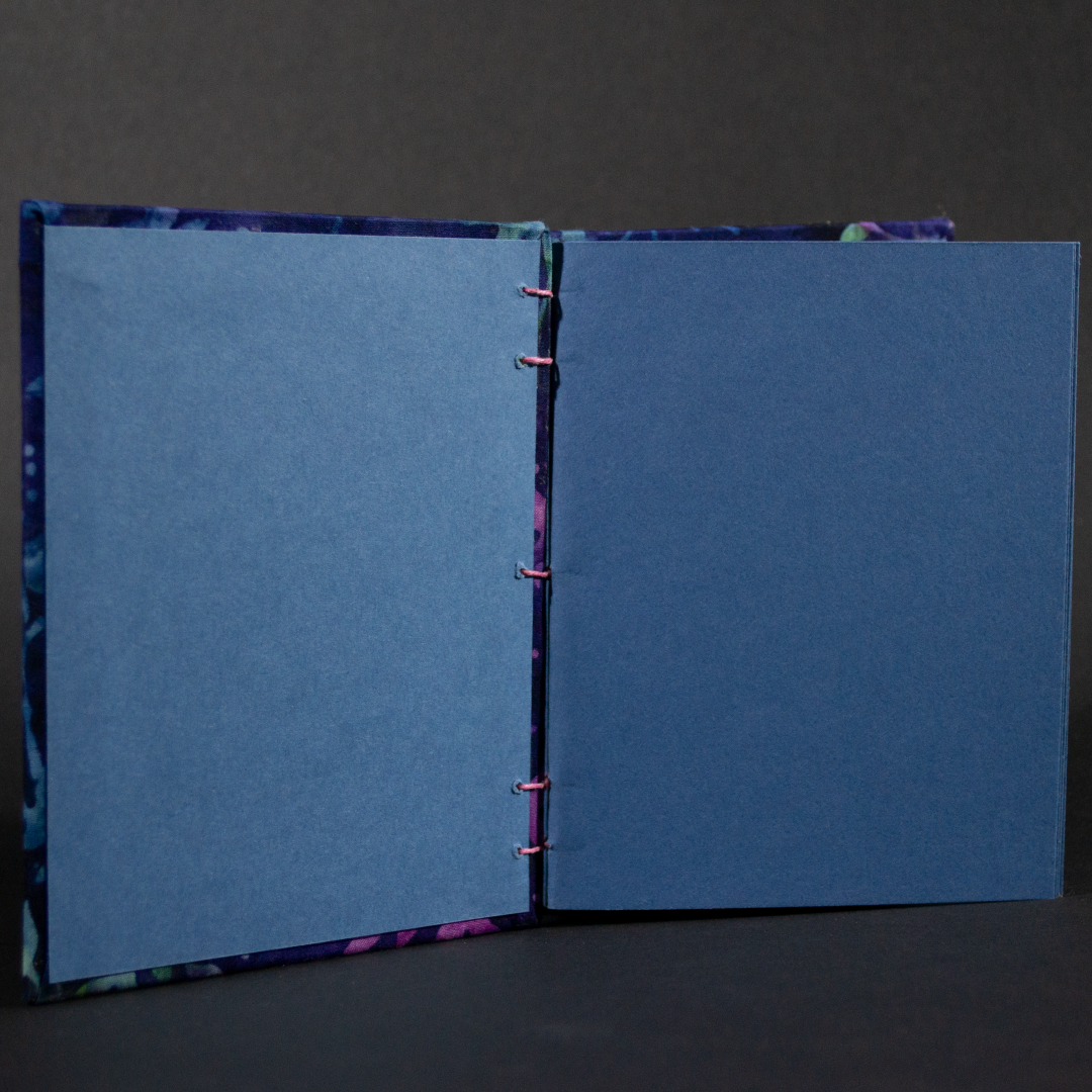 Insides of purple vines batik octavo Coptic book with matching blue cardstock pages and end pages