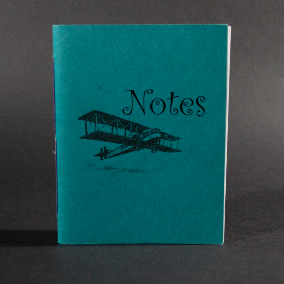 A biplane and the word "Notes" is on the cover of this blue octavo pamphlet book