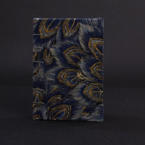 Blue peacock mini coptic bound book cover featuring blue and gold peacock feather