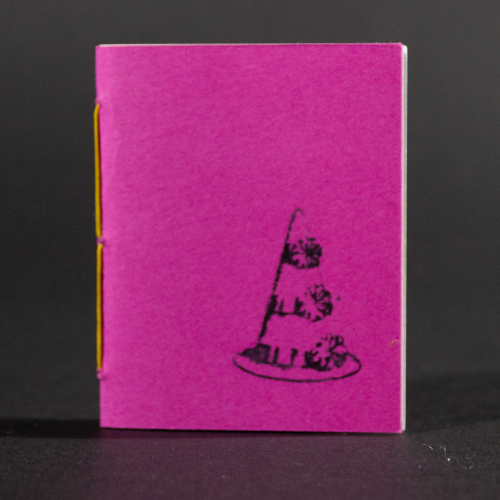 A pink clown hat is transferred on the front cover of this mini pamphlet book