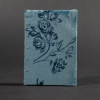 Front cover of vintage blue floral mini Coptic book