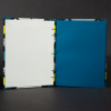Insides of geometric blue and yellow octavo Coptic book with blue cardstock pages and white end pages