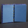Inside shot of celestial mini Coptic book with blue pages and matching end pages