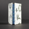Spine view of black and white floral mini Coptic book