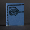 A blue eye graces the front cover of this mini pamphlet book
