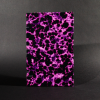 The front cover of the purple batik quarto Coptic bound journal is shades of light to dark purple batik blob shapes