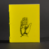 A yellow hand is on the cover of this mini pamphlet book